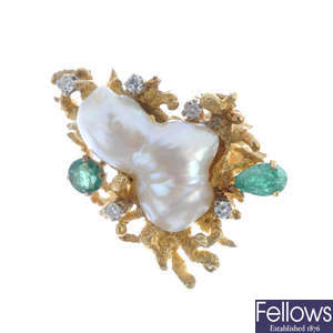A 1970s baroque cultured pearl, emerald and diamond dress ring.