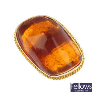 An amber single-stone ring.