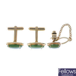 A pair of nephrite jade cufflinks and a tie pin.