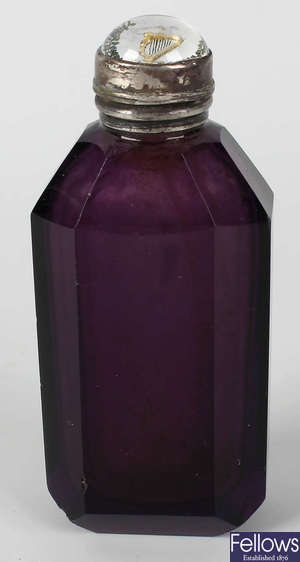 A Victorian amethyst glass scent bottle.