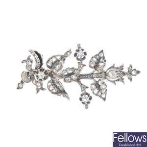 A diamond floral and foliate brooch.