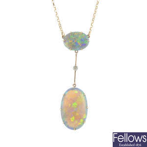 An early 20th century gold, black opal and diamond pendant.