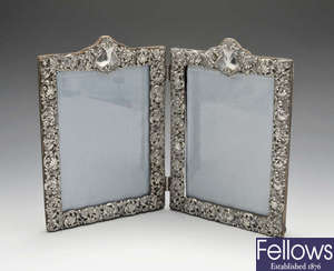 A late Victorian silver mounted double photograph frame.
