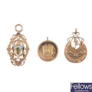 Three early 20th century 9ct gold medallion fobs.