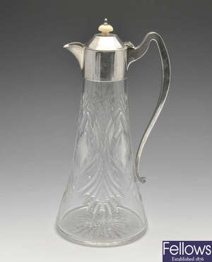 A 1920's silver mounted cut-glass claret jug.