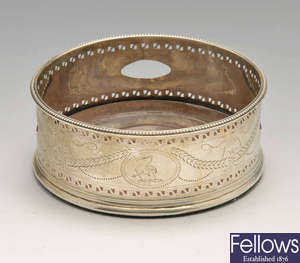A George III silver mounted wine coaster by Hester Bateman.