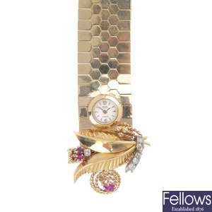 A mid 20th century diamond and gem-set watch bracelet.