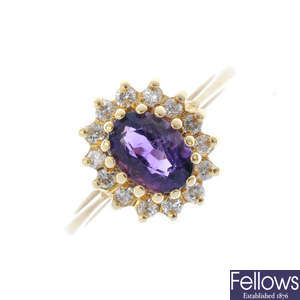 An 18ct gold diamond and amethyst cluster ring.