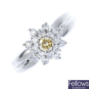 A platinum diamond and 'yellow' diamond cluster ring.