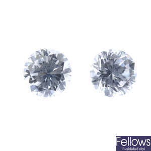 Two brilliant-cut diamonds, weighing 0.32 and 0.34ct.