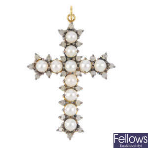 A cultured pearl and diamond cross pendant.