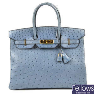 HERMES - a blue ostrich leather Birkin 35 handbag.