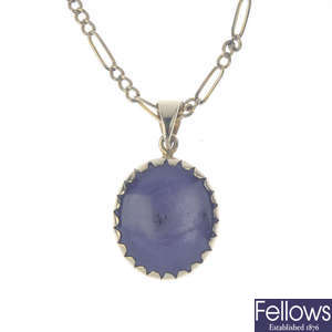 A 9ct gold star sapphire pendant, with chain.