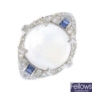 A moonstone, diamond and sapphire ring.