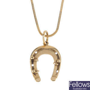 A 1970s 9ct gold horseshoe pendant, with chain.