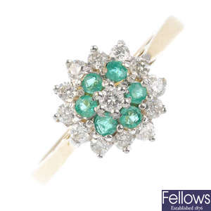 An 18ct gold emerald and diamond cluster ring.