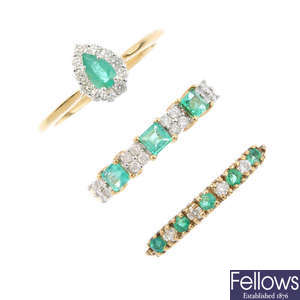 Three 9ct gold emerald and diamond rings.