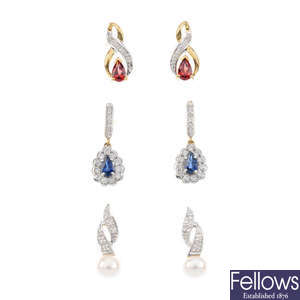 Four pairs of gem-set earrings and a single diamond stud earring.