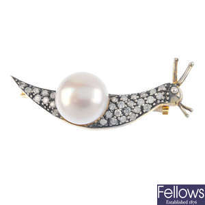A freshwater cultured pearl and diamond snail brooch.