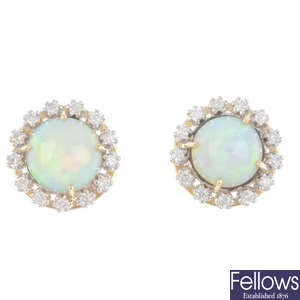 A pair of opal and diamond cluster earrings.