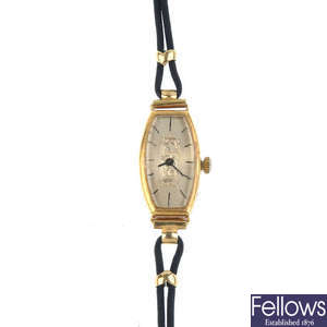 A lady's early 20th century 18ct gold wrist watch on fabric strap.