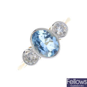 An aquamarine and diamond three-stone ring.