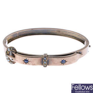 A late Victorian 9ct gold sapphire and split-pearl hinged bangle.