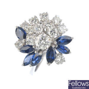 A diamond and sapphire floral cluster ring.