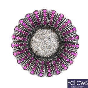 A gem-set floral dress ring.