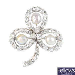 A mid 20th century diamond and pearl three-leaf clover brooch.