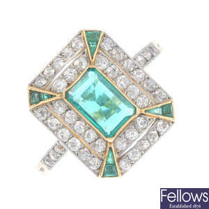 An Art Deco platinum and 18ct gold emerald and diamond ring.