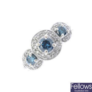 A diamond and colour treated 'blue' diamond dress ring.