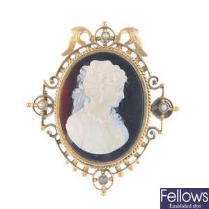 An early 20th century hardstone cameo and split pearl brooch.