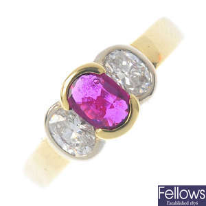 A ruby and diamond three-stone ring.