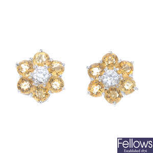 A pair of diamond and citrine cluster earrings.