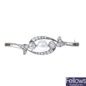An early 20th century gold cultured pearl and diamond brooch.