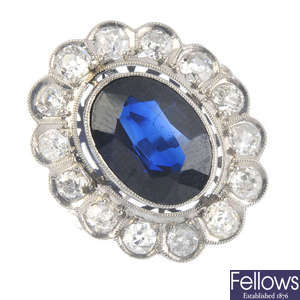 A synthetic sapphire and diamond set cluster ring.