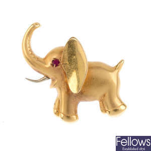 A gem-set elephant brooch.