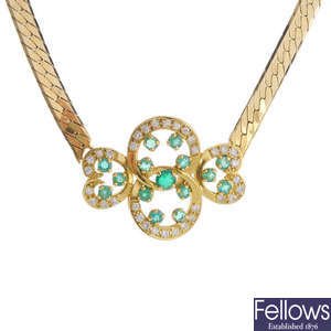 A 9ct gold emerald and diamond necklace.