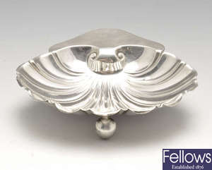 A late Victorian silver shell dish & an Edwardian silver caster. 