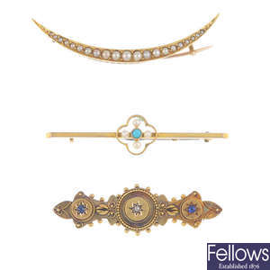 Three gold and gem-set brooches.