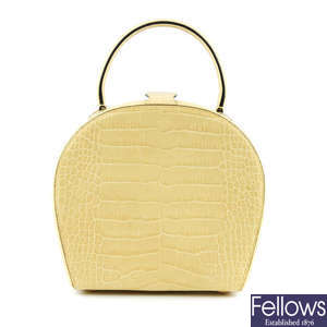 CELINE - an embossed small leather hard case handbag.