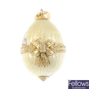 A Russian enamel and diamond egg pendant.
