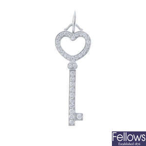 TIFFANY & CO. - a diamond key pendant.