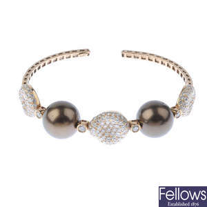 A dyed cultured pearl and diamond bangle.