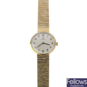 OMEGA - a lady's 1960s 9ct gold wrist watch.