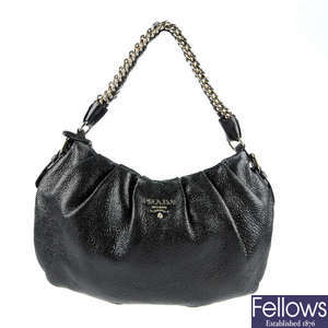 PRADA - a leather handbag.