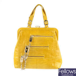 TOD'S - a yellow lizard leather handbag.