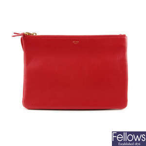 CELINE - a red leather Trio handbag.