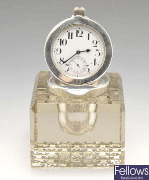 An Edwardian silver mounted and glass inkwell timepiece.